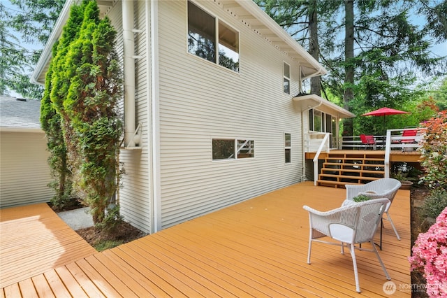wooden deck with outdoor dining space