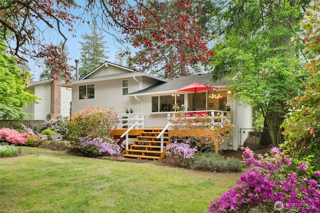 back of house featuring a wooden deck