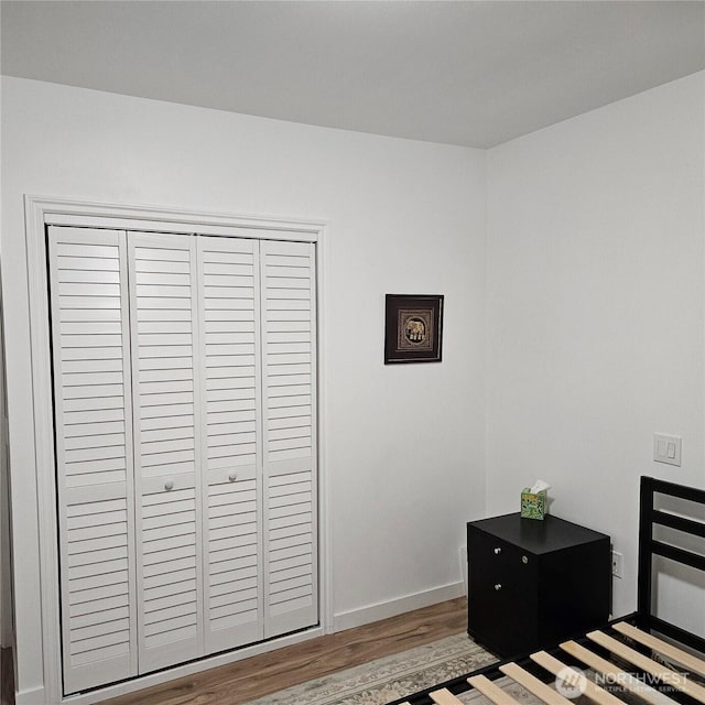 5830 115th Pl NE, Kirkland, WA 98033 - bedroom featuring wood finished floors, baseboards, and a closet
