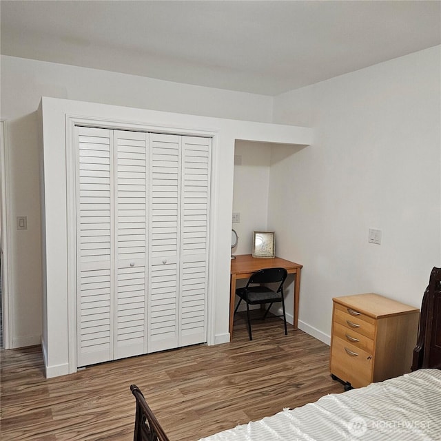 5830 115th Pl NE, Kirkland, WA 98033 - bedroom featuring wood finished floors, baseboards, and a closet