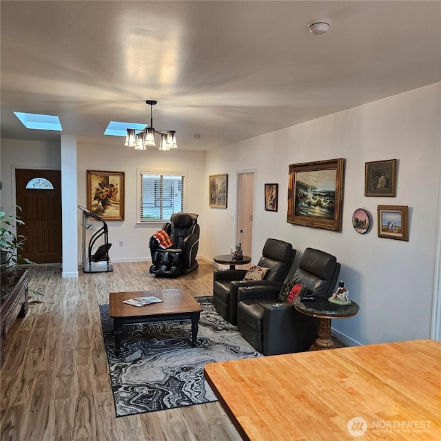 5830 115th Pl NE, Kirkland, WA 98033 - living room featuring a chandelier, wood finished floors, and baseboards