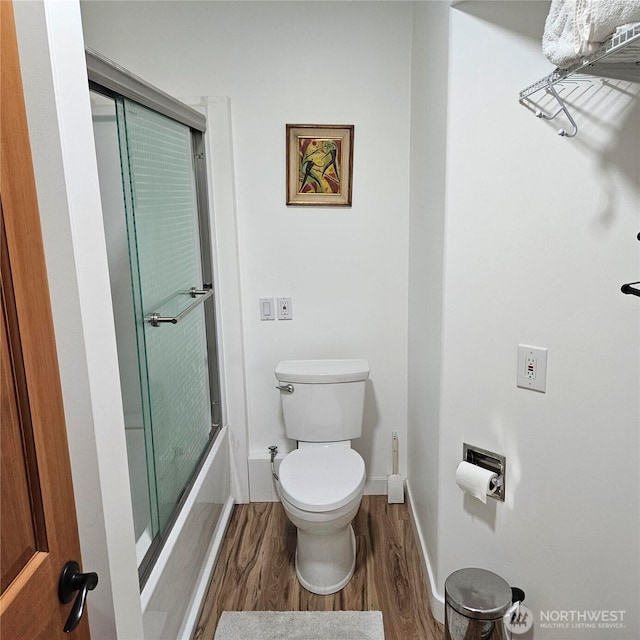5830 115th Pl NE, Kirkland, WA 98033 - full bath with wood finished floors, toilet, baseboards, and enclosed tub / shower combo