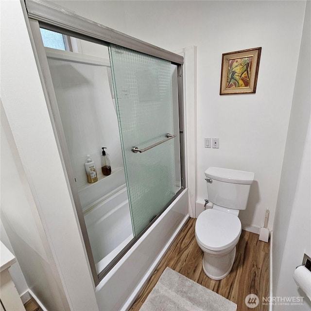 5830 115th Pl NE, Kirkland, WA 98033 - bathroom featuring wood finished floors, toilet, combined bath / shower with glass door, baseboards, and vanity