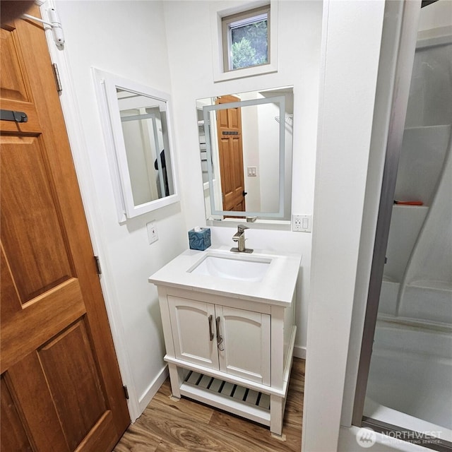 5830 115th Pl NE, Kirkland, WA 98033 - bathroom with vanity, wood finished floors, and baseboards