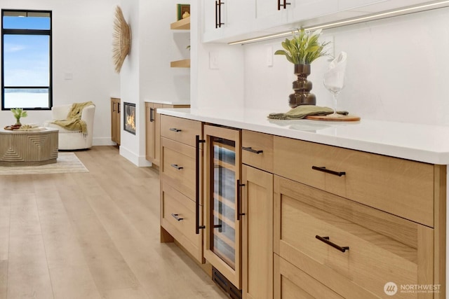 312 N State St Unit 201, Bellingham, WA 98225 - bathroom with wine cooler, wood finished floors, and baseboards
