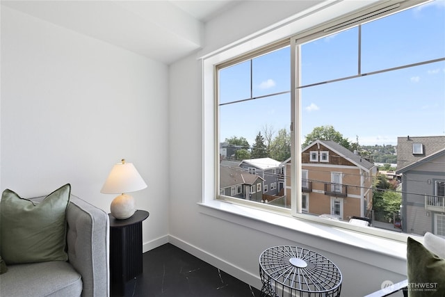 sitting room featuring baseboards