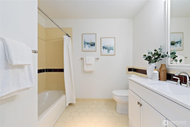 full bathroom featuring toilet, vanity, tile patterned flooring, and shower / tub combo with curtain