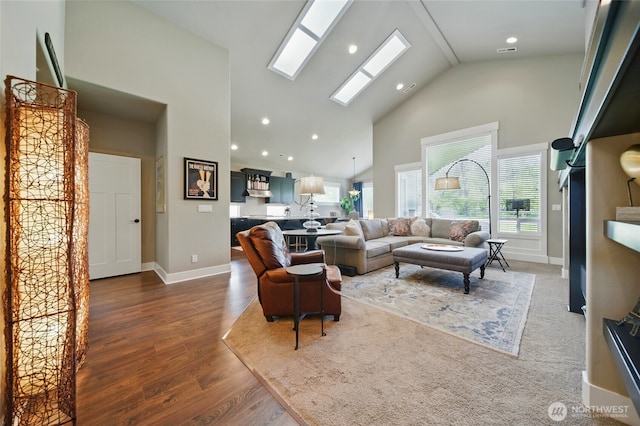 371 Reserve Way, Walla Walla, WA 99362 - living room with high vaulted ceiling, dark wood-type flooring, a skylight, baseboards, and recessed lighting