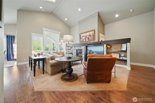 371 Reserve Way, Walla Walla, WA 99362 - living area with wood finished floors, a fireplace, baseboards, high vaulted ceiling, and recessed lighting