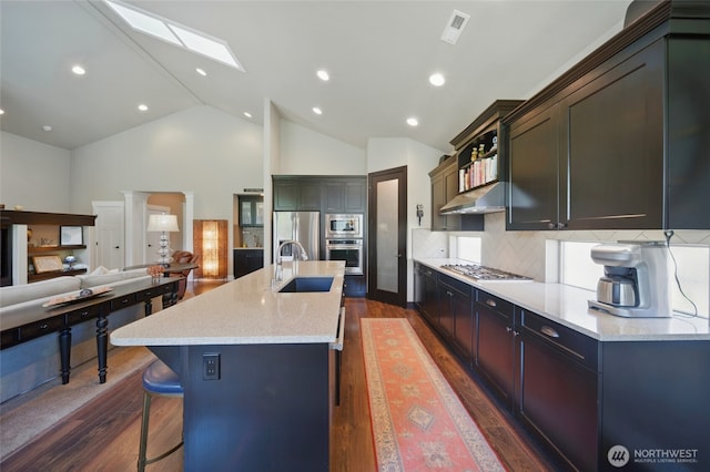 371 Reserve Way, Walla Walla, WA 99362 - kitchen featuring stainless steel appliances, a sink, dark wood-type flooring, a kitchen breakfast bar, and open floor plan