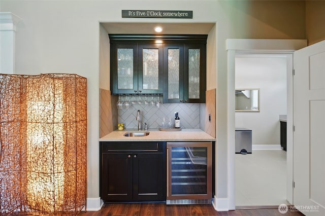371 Reserve Way, Walla Walla, WA 99362 - indoor wet bar with wine cooler, decorative backsplash, dark wood-style floors, and baseboards