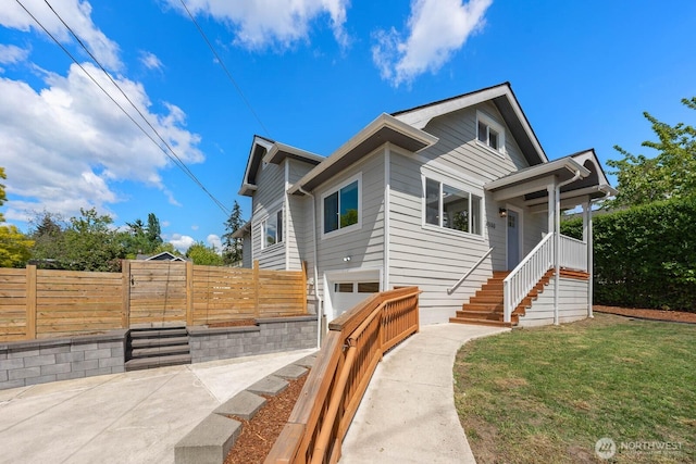 view of front facade with a garage and stairs