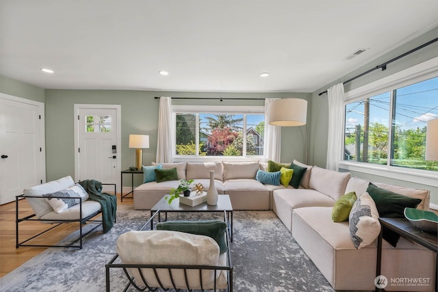 living room featuring recessed lighting and wood finished floors