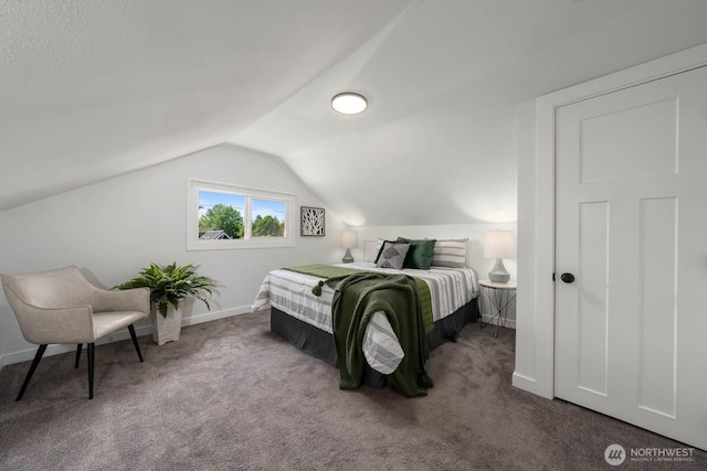 bedroom with lofted ceiling, carpet floors, and baseboards