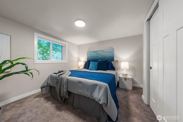 bedroom featuring baseboards and carpet