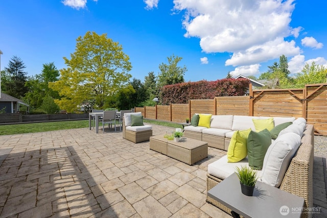 view of patio with an outdoor hangout area, outdoor dining area, and a fenced backyard
