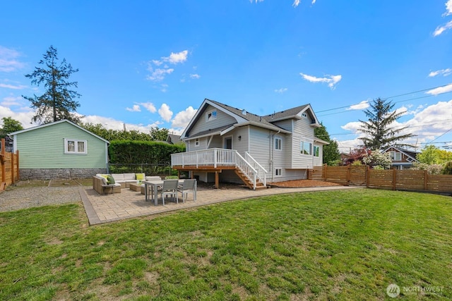 rear view of house featuring outdoor lounge area, a deck, a patio area, and stairway