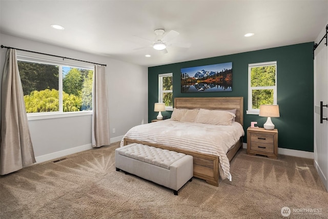 12915 212th St SE, Snohomish, WA 98296 - carpeted bedroom with baseboards, a barn door, recessed lighting, and a ceiling fan
