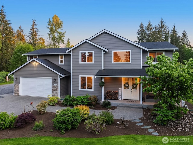 12915 212th St SE, Snohomish, WA 98296 - traditional home featuring asphalt driveway, a porch, and an attached garage