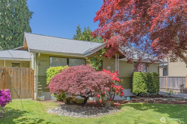 view of property exterior with roof with shingles