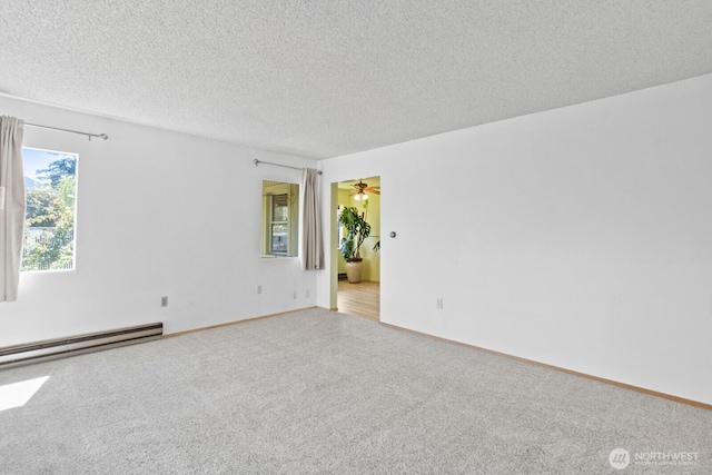 unfurnished room featuring a baseboard radiator, carpet flooring, a textured ceiling, and baseboards