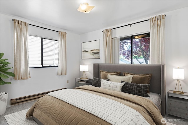 carpeted bedroom with baseboard heating