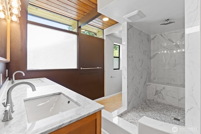 full bathroom featuring a marble finish shower, double vanity, and wood ceiling