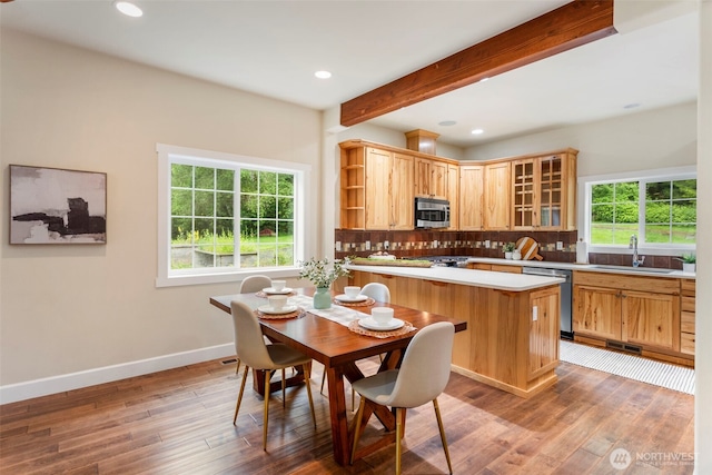 893 Snow Creek Rd, Quilcene, WA 98376 - dining area with wood finished floors, baseboards, beam ceiling, and recessed lighting