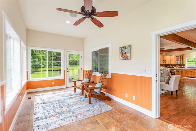 893 Snow Creek Rd, Quilcene, WA 98376 - sitting room with healthy amount of natural light, a wainscoted wall, ceiling fan, and baseboards