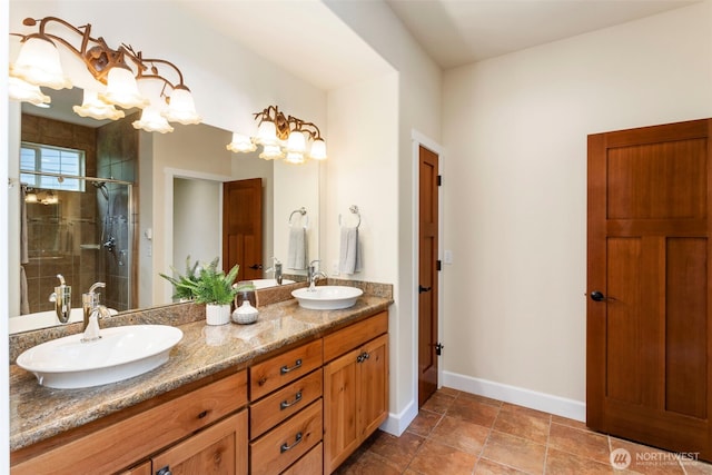 893 Snow Creek Rd, Quilcene, WA 98376 - bathroom featuring double vanity, a stall shower, and baseboards