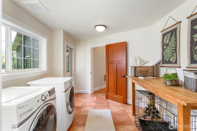 893 Snow Creek Rd, Quilcene, WA 98376 - washroom featuring washer and clothes dryer, baseboards, and light tile patterned floors