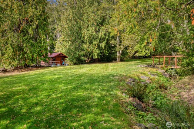 893 Snow Creek Rd, Quilcene, WA 98376 - view of green lawn featuring a forest view
