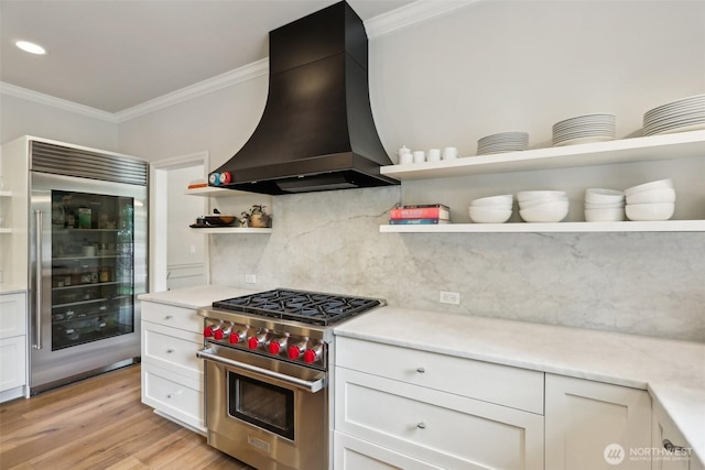 2947 275th Ave SE, Sammamish, WA 98075 - kitchen featuring open shelves, appliances with stainless steel finishes, custom range hood, crown molding, and decorative backsplash