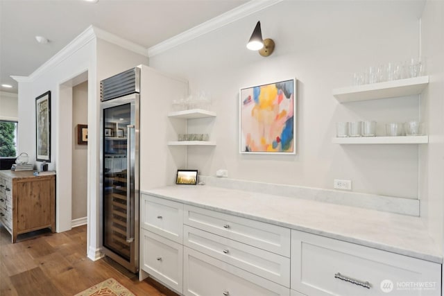 2947 275th Ave SE, Sammamish, WA 98075 - kitchen with open shelves, ornamental molding, wood finished floors, white cabinets, and wine cooler