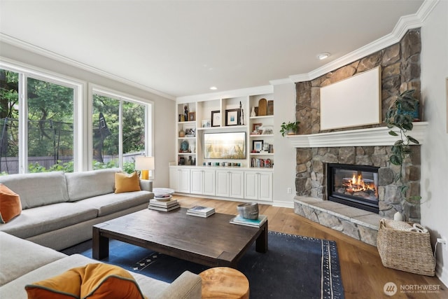 2947 275th Ave SE, Sammamish, WA 98075 - living area with wood finished floors, a fireplace, and ornamental molding