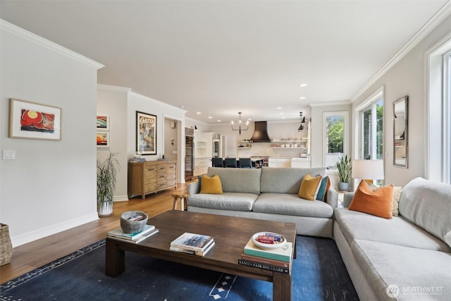 2947 275th Ave SE, Sammamish, WA 98075 - living room with wood finished floors, recessed lighting, baseboards, crown molding, and a chandelier
