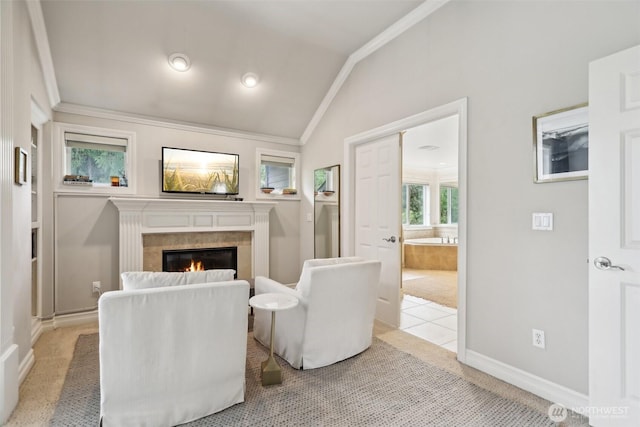 2947 275th Ave SE, Sammamish, WA 98075 - living room featuring crown molding, lofted ceiling, a glass covered fireplace, light colored carpet, and baseboards