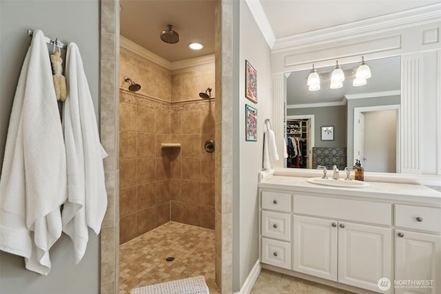 2947 275th Ave SE, Sammamish, WA 98075 - full bathroom with ornamental molding, vanity, a tile shower, a spacious closet, and tile patterned flooring