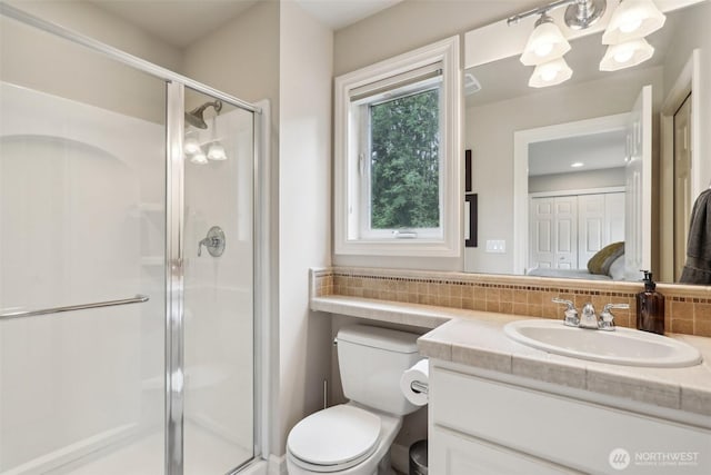 2947 275th Ave SE, Sammamish, WA 98075 - ensuite bathroom with vanity, tasteful backsplash, a shower stall, and toilet