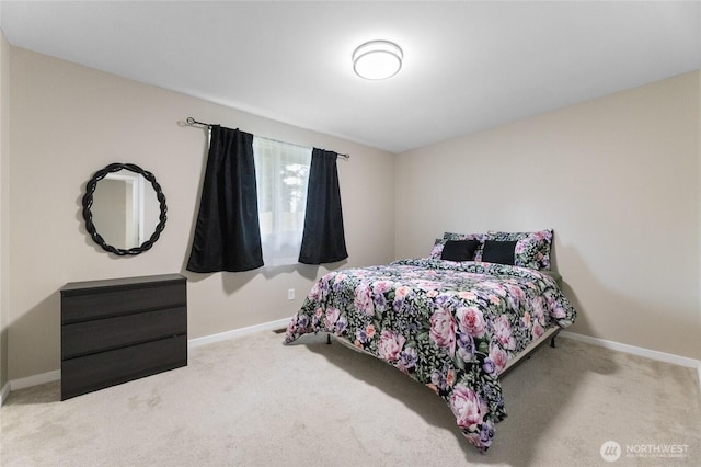 carpeted bedroom featuring baseboards
