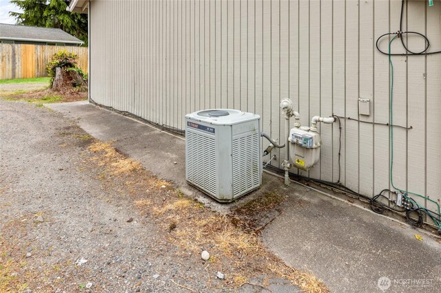 exterior view of central AC, gas meter, and fence