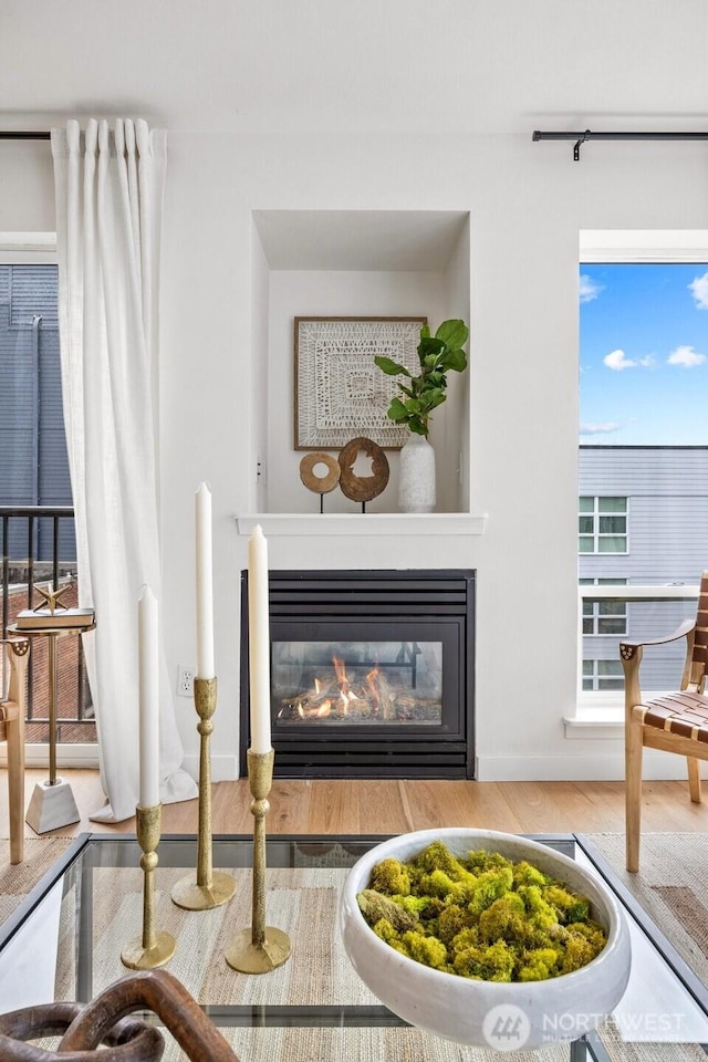 323 Queen Anne Ave N Unit 502, Seattle, WA 98109 - detailed view of wood finished floors and a glass covered fireplace