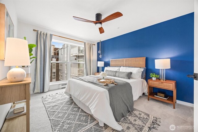 323 Queen Anne Ave N Unit 502, Seattle, WA 98109 - carpeted bedroom with baseboards and a ceiling fan
