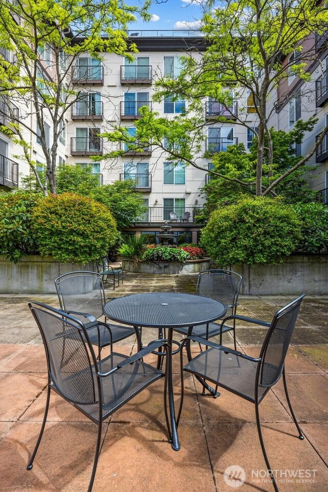 323 Queen Anne Ave N Unit 502, Seattle, WA 98109 - view of patio / terrace with outdoor dining space
