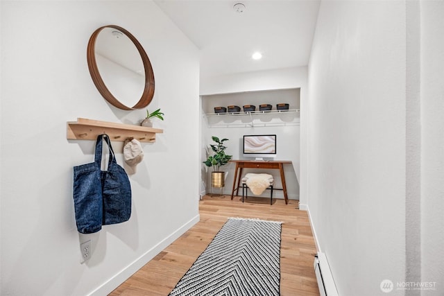 323 Queen Anne Ave N Unit 502, Seattle, WA 98109 - hallway with light wood finished floors, a baseboard heating unit, baseboards, and recessed lighting