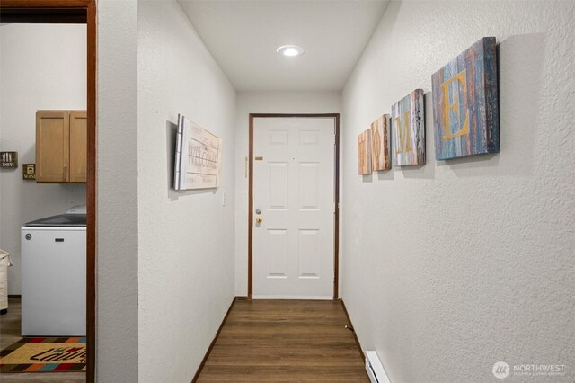 hallway with washer / clothes dryer, dark wood-style floors, a textured wall, and recessed lighting