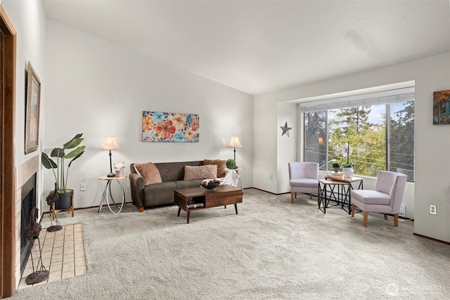 carpeted living room with lofted ceiling, baseboards, and a fireplace