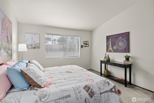 carpeted bedroom with baseboards