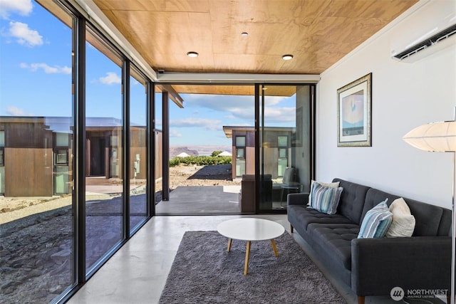23648 NW Cliffe Pointe Rd Unit 10B, Quincy, WA 98848 - living room with floor to ceiling windows, a wall mounted AC, wood ceiling, plenty of natural light, and concrete flooring