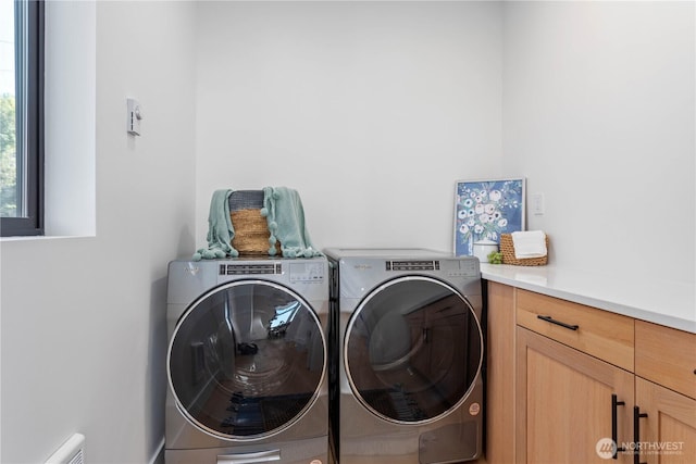 312 N State St Unit 101, Bellingham, WA 98225 - clothes washing area with washer and dryer and cabinet space